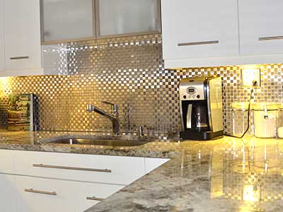 Metal backsplash tiles installed by TLC Tile Pros Tampa